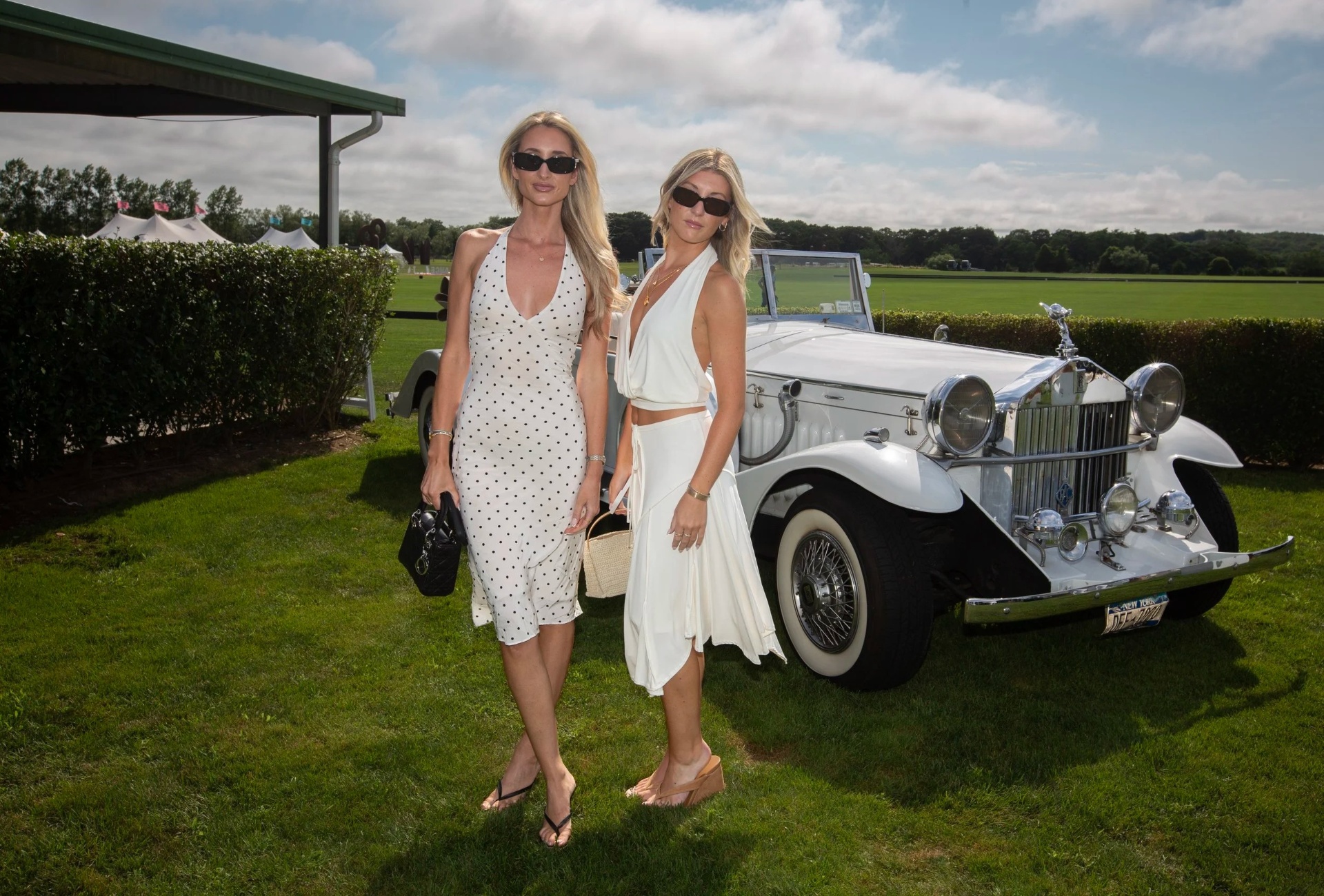 Duo posing with a vintage Rolls-Royce